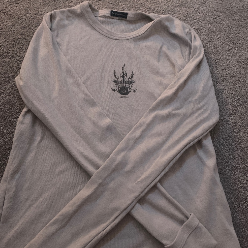 It’s a grey long sleeve top